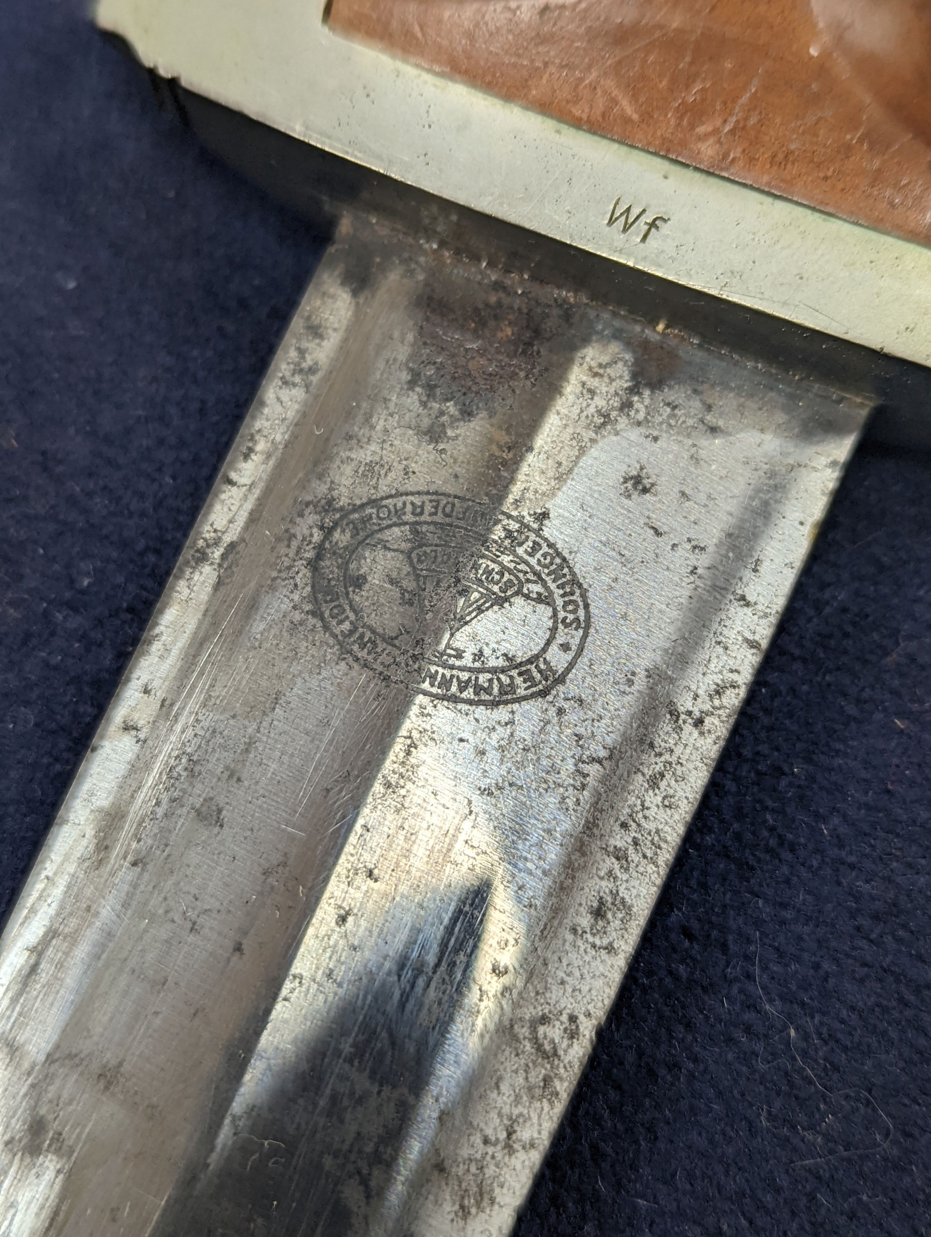 A Third Reich SA dagger within sheath, blade 22cm., and a bayonet within scabbard
